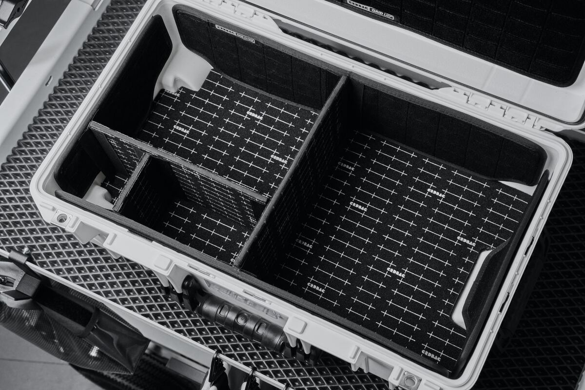 The interior of a validated medical transport case, partitioned and instrumented.